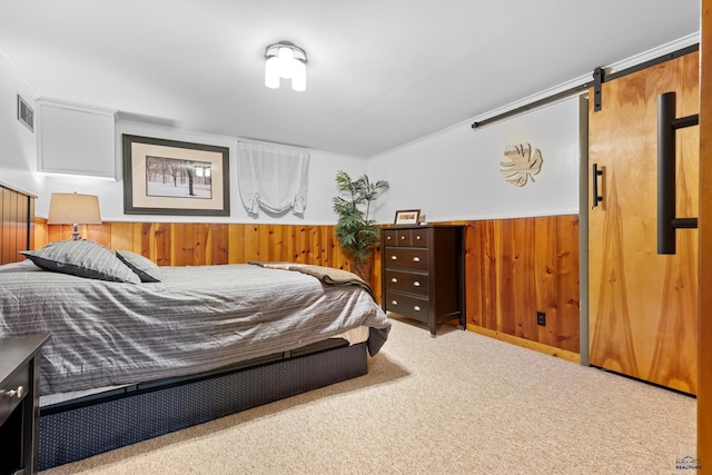 2739 W W St, Anne, Rapid City, SD 57701 - carpeted bedroom featuring wood walls and a barn door