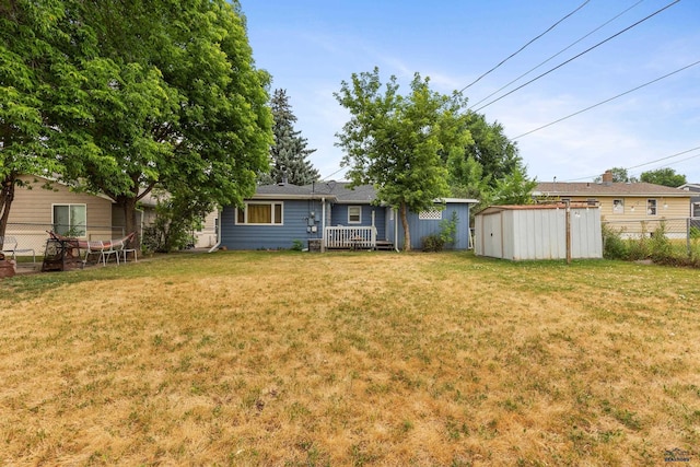 2739 W W St, Anne, Rapid City, SD 57701 - view of yard with a storage unit, an outdoor structure, and a deck