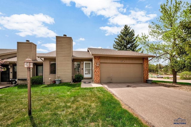 4801 Prairie Rose Pl, Rapid City, SD 57702 - view of front facade featuring asphalt driveway, an attached garage, a front lawn, a chimney, and roof with shingles