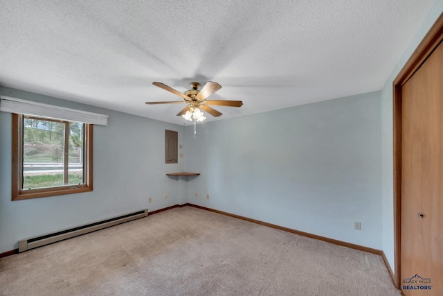 4801 Prairie Rose Pl, Rapid City, SD 57702 - unfurnished room featuring a baseboard heating unit, light colored carpet, a ceiling fan, a textured ceiling, and baseboards