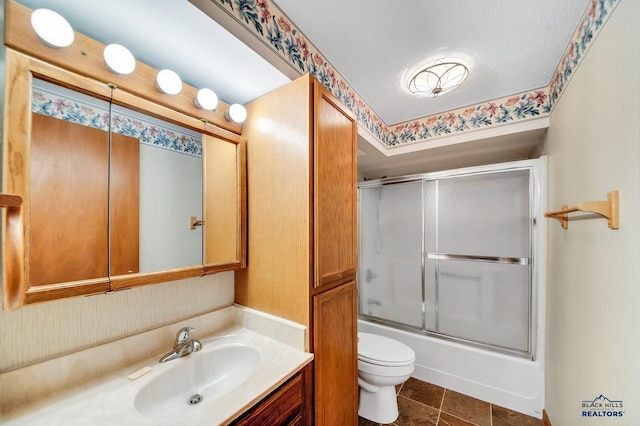 4801 Prairie Rose Pl, Rapid City, SD 57702 - bathroom with toilet, vanity, and enclosed tub / shower combo