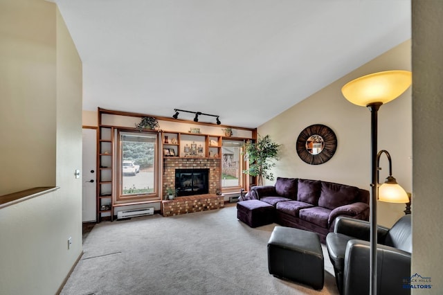4801 Prairie Rose Pl, Rapid City, SD 57702 - living area featuring carpet, a baseboard heating unit, a fireplace, and rail lighting