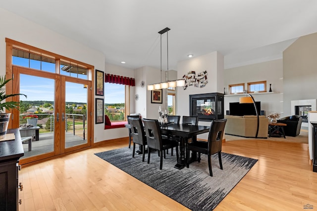 6717 Kennemer Dr, Rapid City, SD 57702 - dining space featuring light wood-style floors, french doors, and recessed lighting