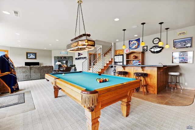 6717 Kennemer Dr, Rapid City, SD 57702 - playroom featuring a dry bar, pool table, a glass covered fireplace, recessed lighting, and light tile patterned floors