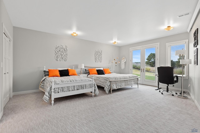 6717 Kennemer Dr, Rapid City, SD 57702 - carpeted bedroom with access to outside, baseboards, and a desk