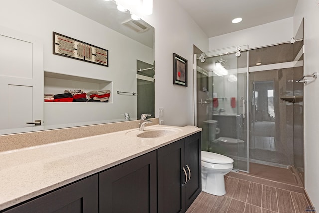 6717 Kennemer Dr, Rapid City, SD 57702 - full bath with toilet, a stall shower, and vanity