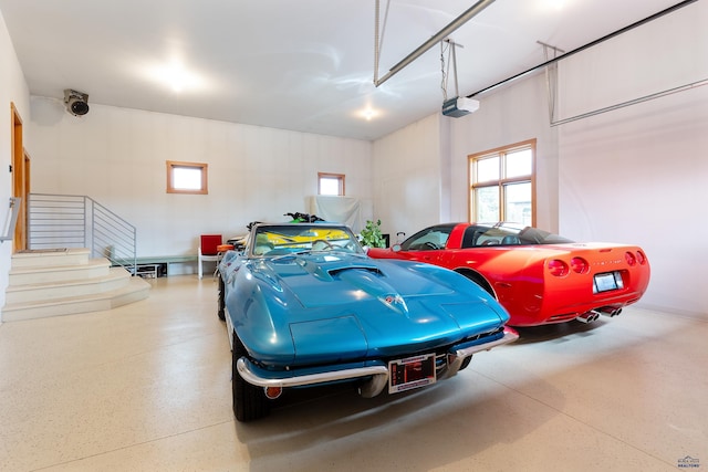 6717 Kennemer Dr, Rapid City, SD 57702 - garage featuring a garage door opener