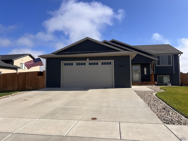 3620 Remington Rd, Rapid City, SD 57703 - view of front of home featuring fence, a garage, and driveway