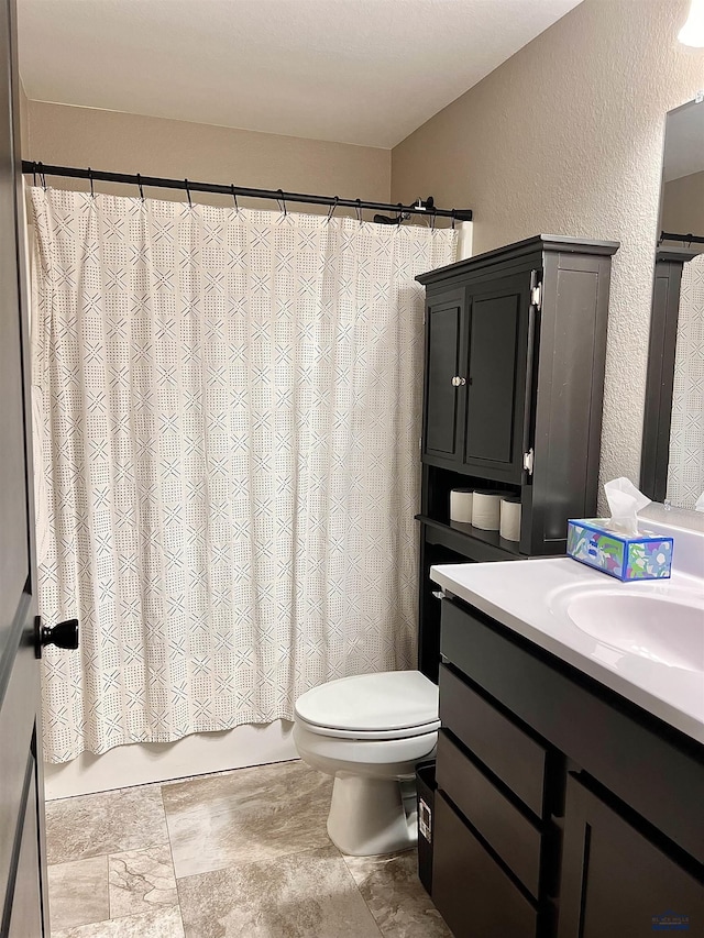 3620 Remington Rd, Rapid City, SD 57703 - full bath featuring a textured wall, toilet, vanity, and shower / bath combo with shower curtain