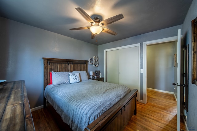 1421 12th Ave, Belle Fourche, SD 57717 - bedroom featuring light wood finished floors, baseboards, a closet, and a ceiling fan