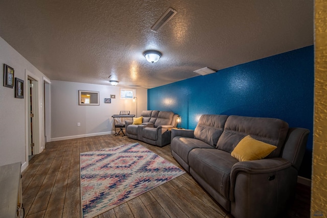 1421 12th Ave, Belle Fourche, SD 57717 - home theater featuring hardwood / wood-style flooring, a textured ceiling, and baseboards