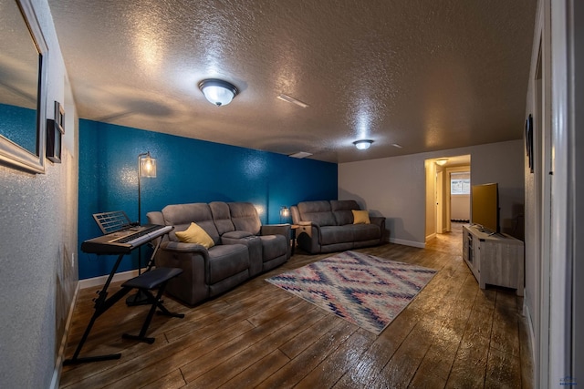 1421 12th Ave, Belle Fourche, SD 57717 - living area featuring a textured ceiling, hardwood / wood-style floors, a textured wall, and baseboards