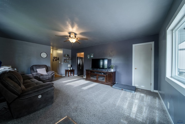 1421 12th Ave, Belle Fourche, SD 57717 - carpeted living area with baseboards and ceiling fan