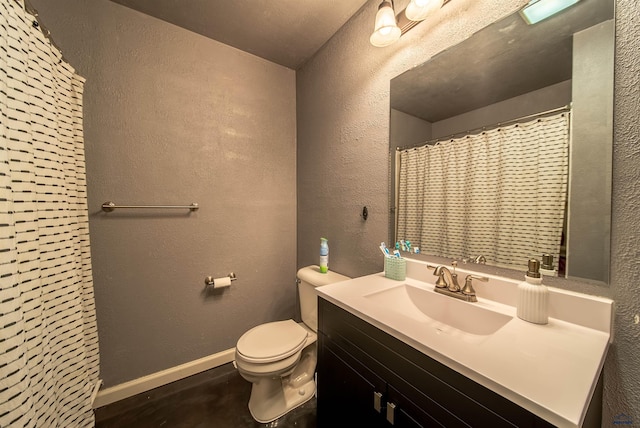 1421 12th Ave, Belle Fourche, SD 57717 - full bath with toilet, vanity, a textured wall, baseboards, and a shower with curtain