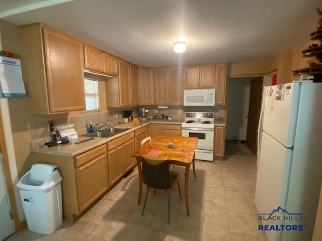 1220 Shephard St, Sturgis, SD 57785 - kitchen with white appliances, a sink, light countertops, tasteful backsplash, and light brown cabinetry
