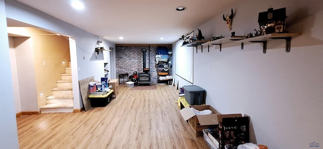 4737 Haven, Rapid City, SD 57703 - workout area featuring a wood stove, wood finished floors, recessed lighting, and baseboards