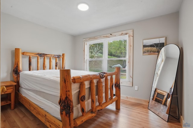 385 15th St, Sturgis, SD 57785 - bedroom with light wood-style floors and baseboards