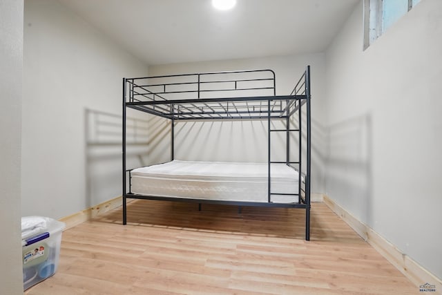 385 15th St, Sturgis, SD 57785 - bedroom featuring wood finished floors and baseboards