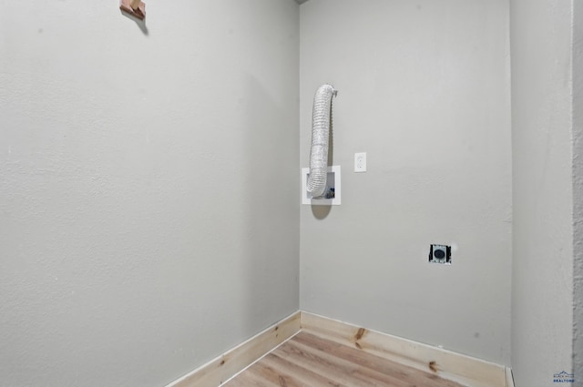 385 15th St, Sturgis, SD 57785 - clothes washing area featuring hookup for an electric dryer, light wood-type flooring, baseboards, and hookup for a washing machine