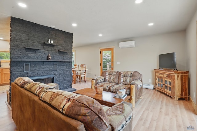 385 15th St, Sturgis, SD 57785 - living room with a wall unit AC, healthy amount of natural light, light wood-style flooring, baseboard heating, and recessed lighting