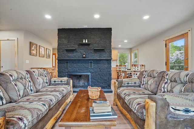 385 15th St, Sturgis, SD 57785 - living area with light wood-style floors, recessed lighting, and a fireplace