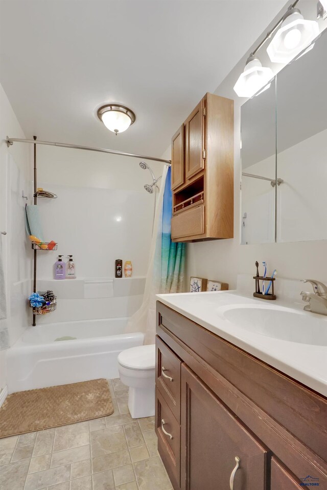 712 Stanley, Belle Fourche, SD 57717 - bathroom featuring shower / bath combo, toilet, and vanity