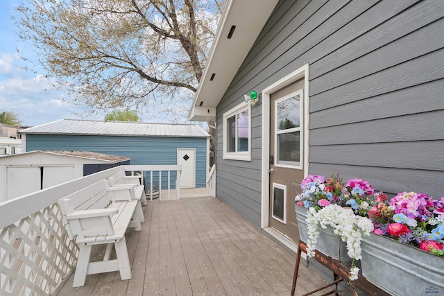 712 Stanley, Belle Fourche, SD 57717 - deck with an outbuilding and a shed