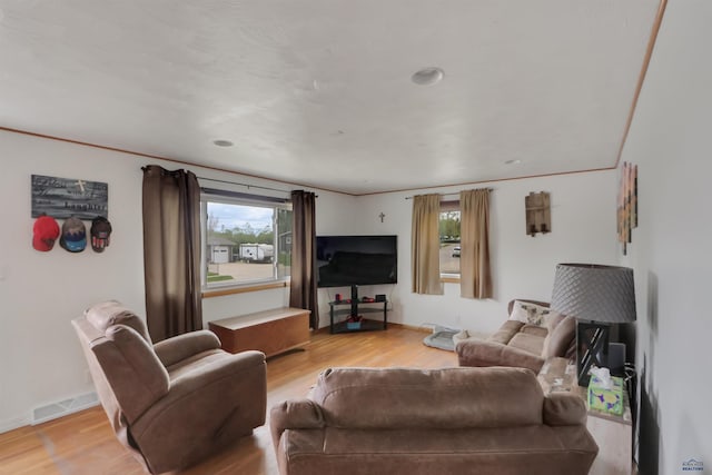 712 Stanley, Belle Fourche, SD 57717 - living area featuring light wood-style flooring and baseboards