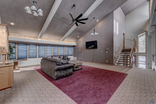 3968 Fairway Hills Dr, Rapid City, SD 57702 - living area with carpet floors, high vaulted ceiling, ceiling fan, stairs, and a chandelier