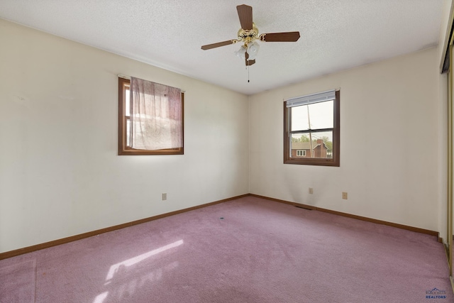 6312 Fairway Dr, Black Hawk, SD 57718 - spare room featuring carpet flooring, a textured ceiling, a ceiling fan, and baseboards
