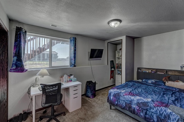 22970 Candlelight Dr, Rapid City, SD 57703 - bedroom with carpet flooring, a textured ceiling, an office area, and baseboards