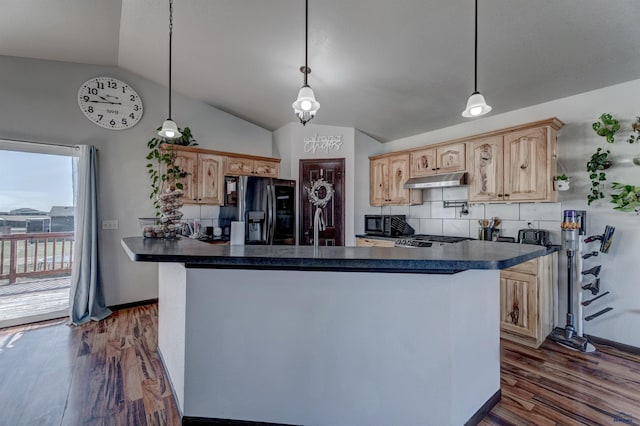 22970 Candlelight Dr, Rapid City, SD 57703 - kitchen featuring black appliances, dark countertops, lofted ceiling, light brown cabinetry, and under cabinet range hood
