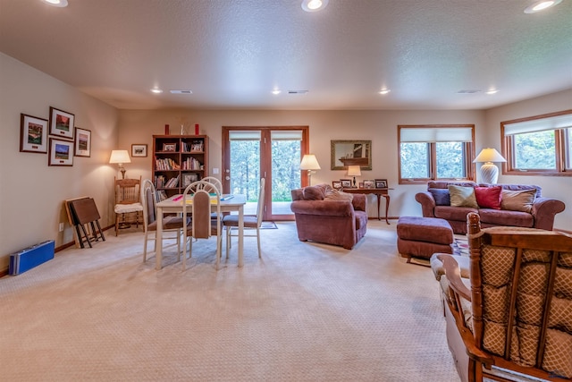 6516 Muirfield Dr, Rapid City, SD 57702 - living area with light colored carpet, recessed lighting, plenty of natural light, and baseboards
