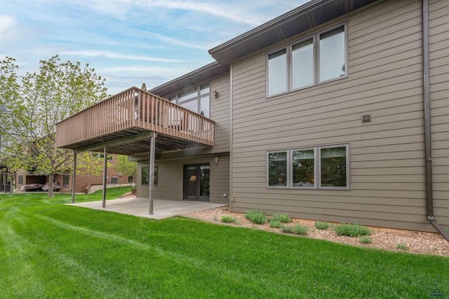 6516 Muirfield Dr, Rapid City, SD 57702 - back of property featuring a patio, a lawn, and a wooden deck