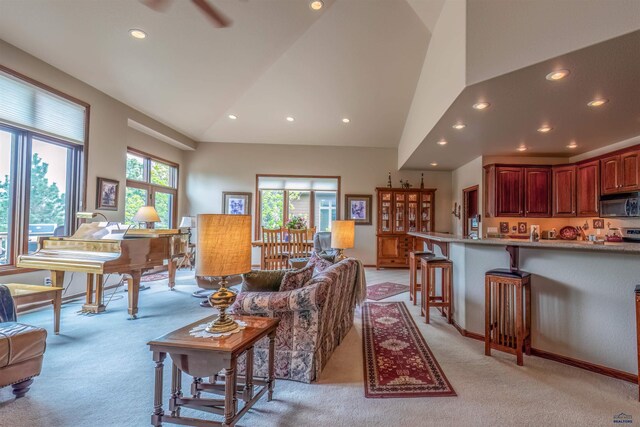 6516 Muirfield Dr, Rapid City, SD 57702 - living area with light colored carpet, recessed lighting, high vaulted ceiling, and ceiling fan