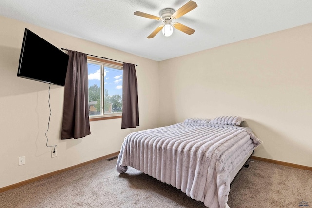 5436 Weathervane Ln, Rapid City, SD 57703 - bedroom with carpet flooring, baseboards, and ceiling fan
