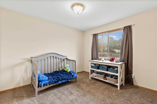 5436 Weathervane Ln, Rapid City, SD 57703 - carpeted bedroom featuring baseboards and a textured ceiling