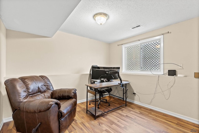 5436 Weathervane Ln, Rapid City, SD 57703 - office space featuring wood finished floors, baseboards, and a textured ceiling