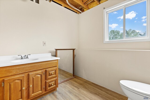 5436 Weathervane Ln, Rapid City, SD 57703 - bathroom with vanity, toilet, and wood finished floors