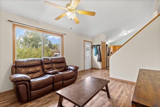 5436 Weathervane Ln, Rapid City, SD 57703 - living area featuring light wood-style floors, ceiling fan, and vaulted ceiling