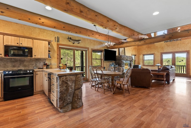 22600 Jenny Gulch Rd Unit 22600/22636Jenny, Gulch Rd, Rapid City, SD 57702 - kitchen featuring black appliances, light brown cabinets, a peninsula, beamed ceiling, and light wood-style flooring