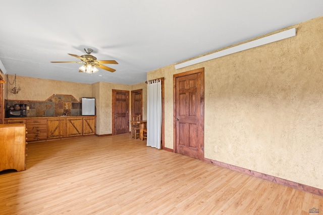 22600 Jenny Gulch Rd Unit 22600/22636Jenny, Gulch Rd, Rapid City, SD 57702 - unfurnished living room with light wood-type flooring, a ceiling fan, and baseboards