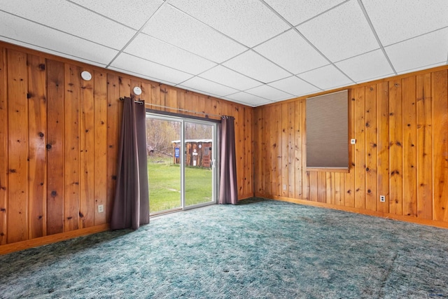 22600 Jenny Gulch Rd Unit 22600/22636Jenny, Gulch Rd, Rapid City, SD 57702 - spare room with carpet, wood walls, a drop ceiling, and baseboards