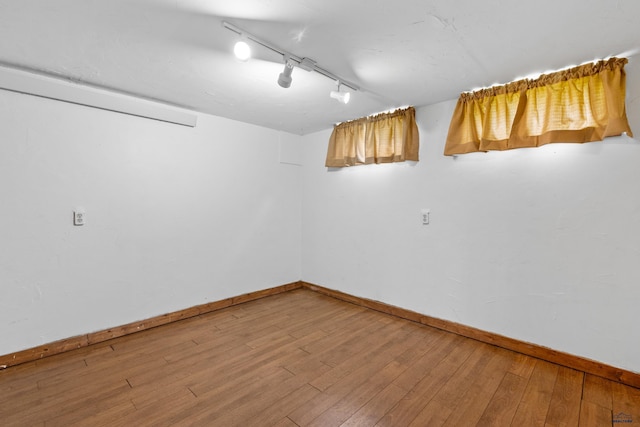 22600 Jenny Gulch Rd Unit 22600/22636Jenny, Gulch Rd, Rapid City, SD 57702 - finished below grade area featuring track lighting, baseboards, and hardwood / wood-style floors