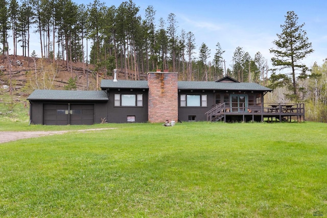 22600 Jenny Gulch Rd Unit 22600/22636Jenny, Gulch Rd, Rapid City, SD 57702 - back of house featuring driveway, a lawn, a chimney, and a deck