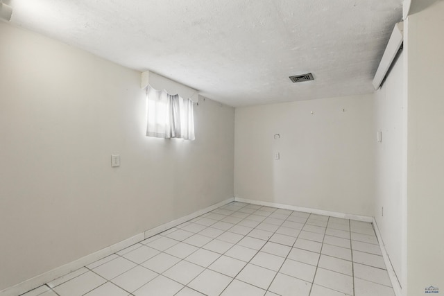 22600 Jenny Gulch Rd Unit 22600/22636Jenny, Gulch Rd, Rapid City, SD 57702 - spare room with baseboards, a textured ceiling, and light tile patterned floors