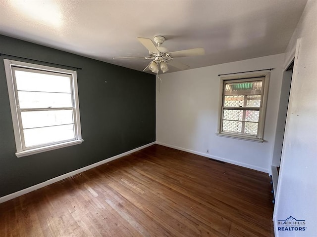 204 3rd Ave, Edgemont, SD 57735 - empty room featuring hardwood / wood-style floors, a ceiling fan, and baseboards