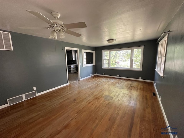 204 3rd Ave, Edgemont, SD 57735 - empty room featuring wood finished floors, baseboards, and ceiling fan