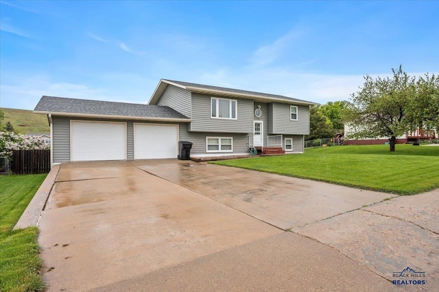 720 S 32nd, Spearfish, SD 57783 - split foyer home featuring a garage and concrete driveway