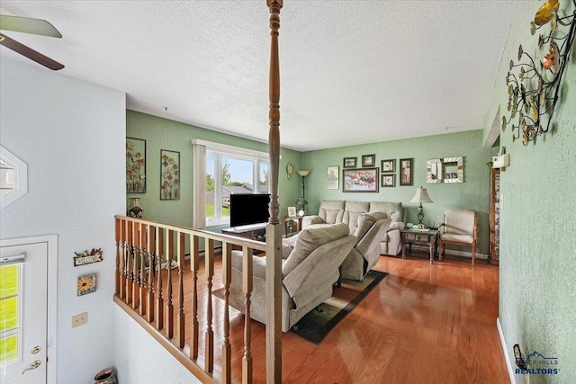 720 S 32nd, Spearfish, SD 57783 - living room featuring wood finished floors, a textured ceiling, and ceiling fan